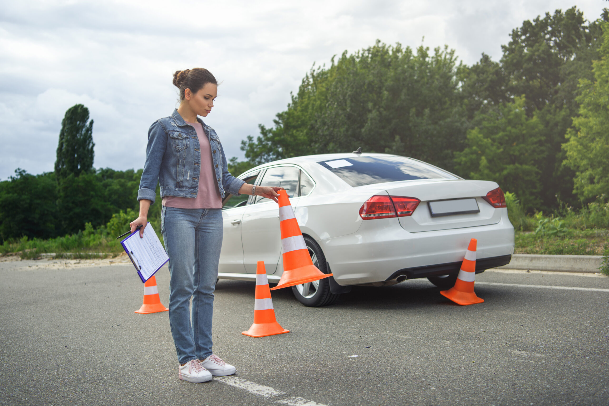 driver holding car insurance and putting traffic c 2023 11 27 05 36 58 utc scaled